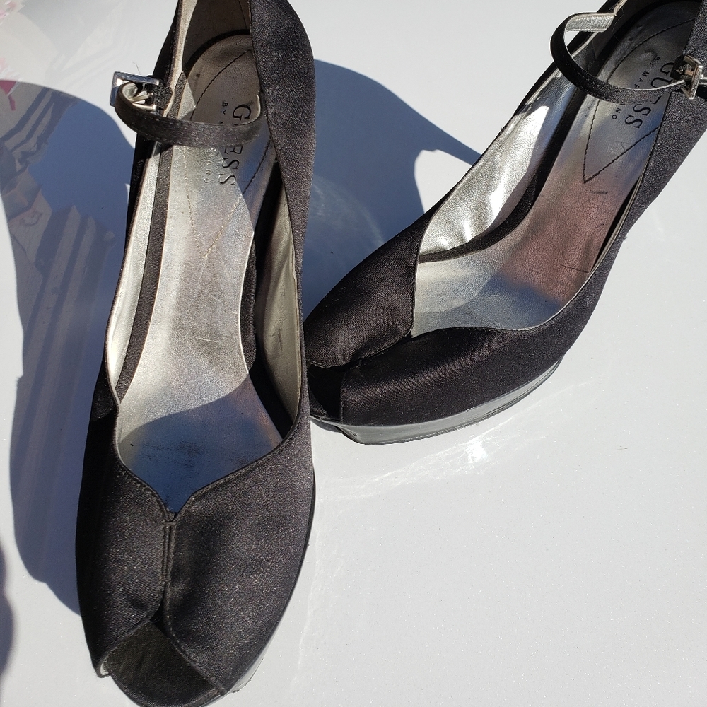 Black GUESS stillettos made of material. Size 9